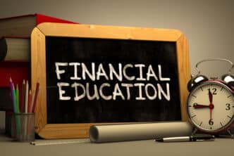 Financial Education Handwritten by white Chalk on a Blackboard.